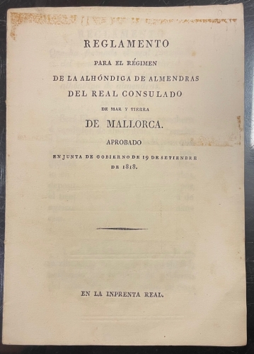 Portada de Reglamento para el R�gimen de la Alh�ndiga de Almendras del Real Consulado de Mar y Tierra de Mallorca. Aprobado en Junta de Gobierno de 19 de Setiembre de 1818